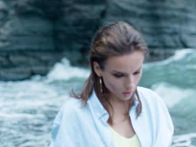 Blurry silhouette of a person moving gracefully.