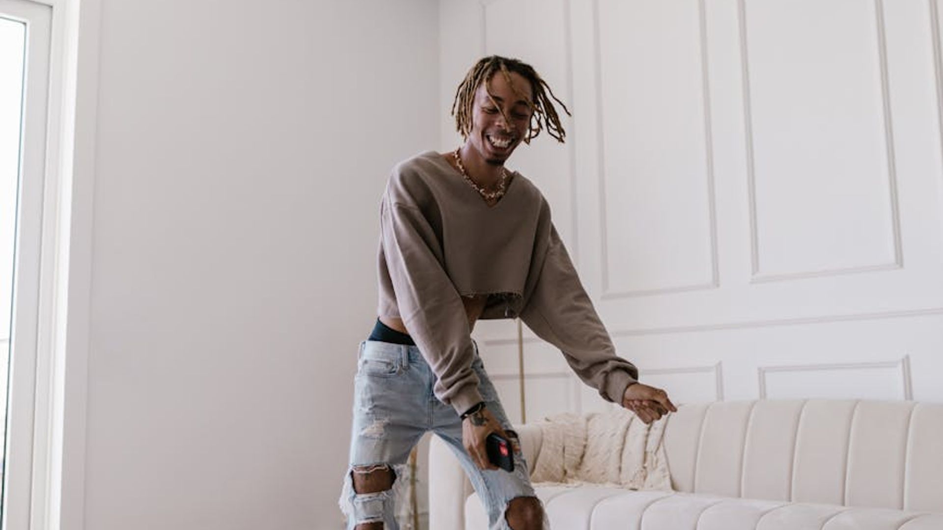 Person doing light movements in a bright airy room.